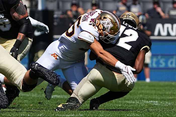 Minnesota linebacker Mariano Sori-Marin (55) tackles Colorado quarterback Brendon Lewis (12).